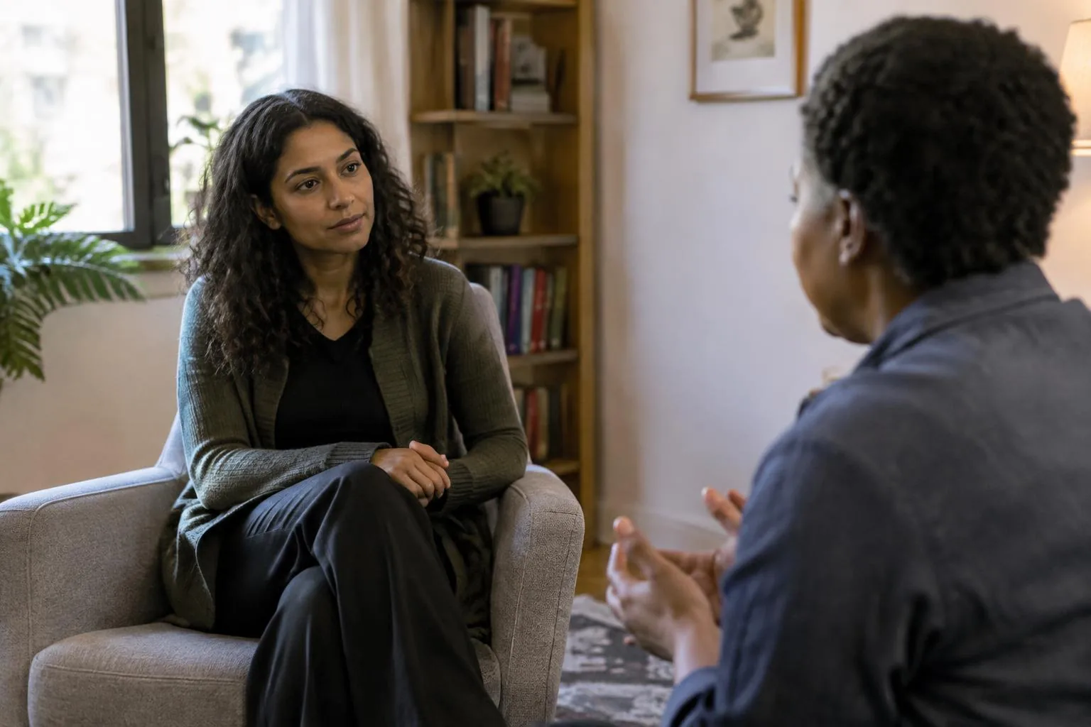 Psychologist listening to a client in a calm consulting room